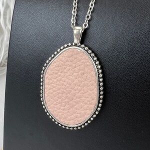 Silver tone, long double sided pale, pink and gray costume pendant
